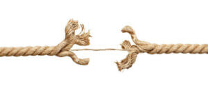 close up of a rope under pressure on white background